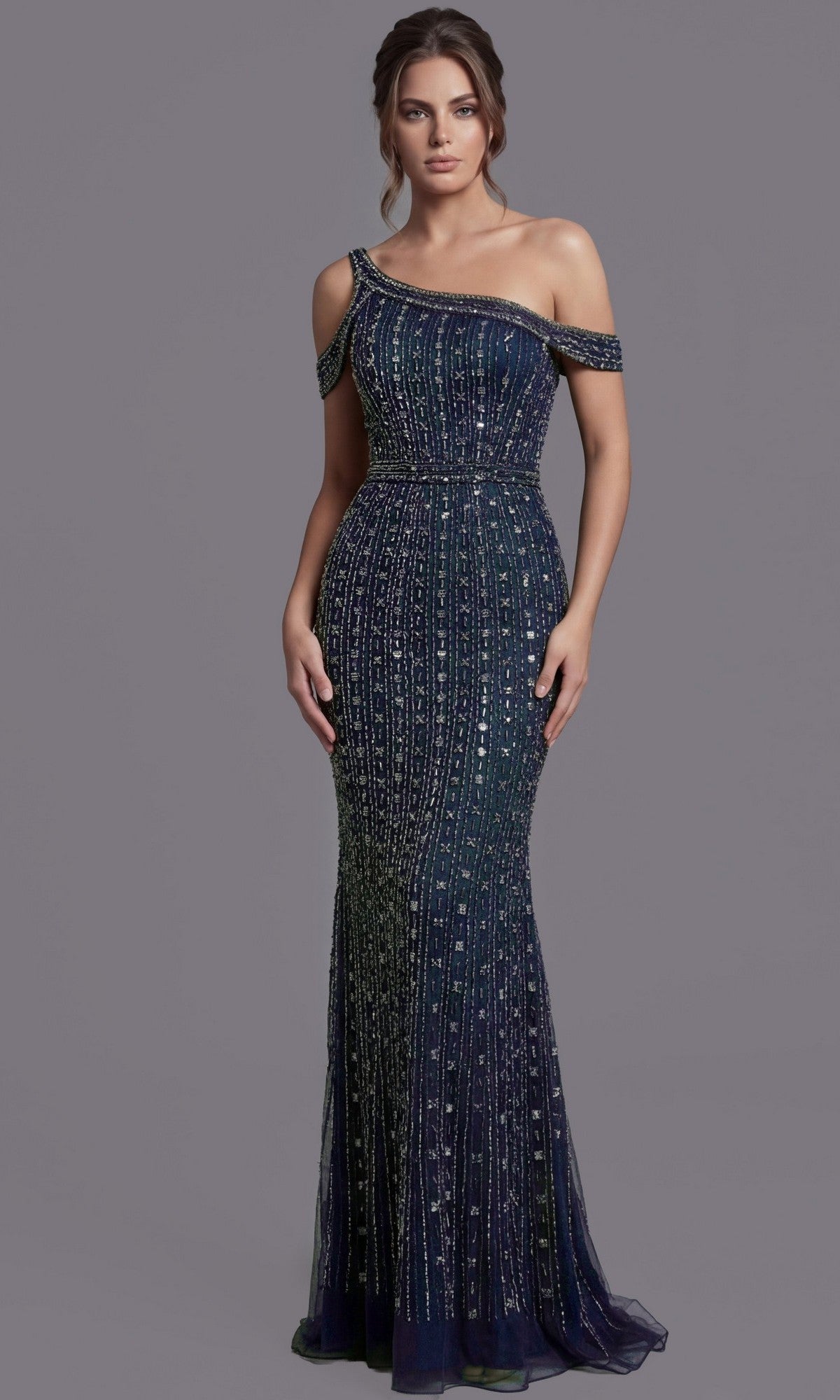 A woman wearing the Jovani Asymmetrical Beaded Long Formal Dress 03124 in navy, a floor-length, one-shoulder gown adorned with sequin embellishments, stands against a plain gray background.